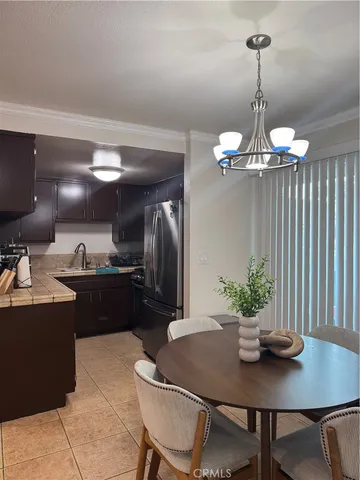 a kitchen with a table and chairs in it