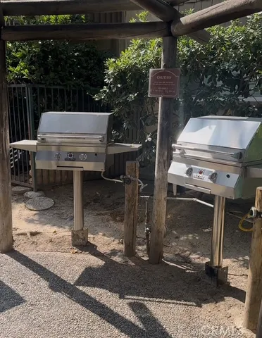 a view of a patio with a table and chairs