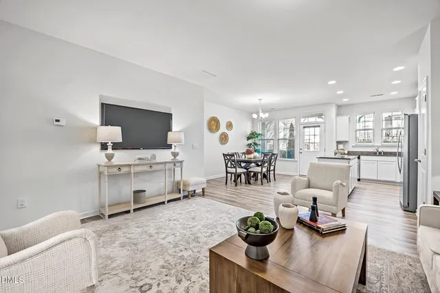 a living room with furniture and flat screen tv