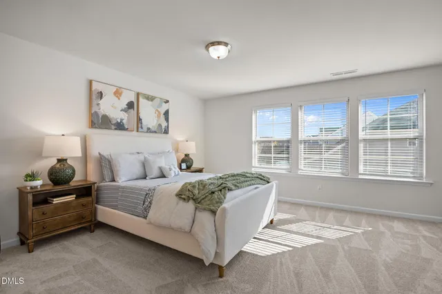 a bedroom with a bed and glass window