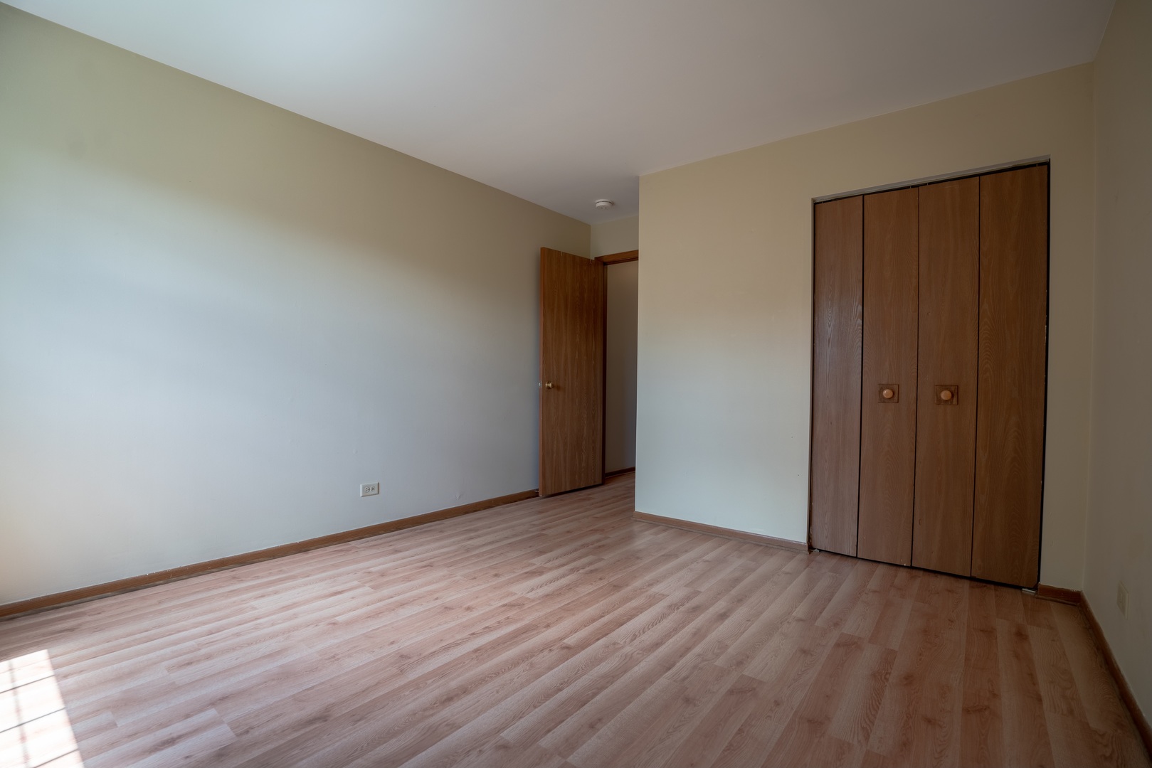 20 Gant Circle, Unit E Streamwood, IL 60107 - Photo 11 of 20 a view of an empty room with wooden floor and closet