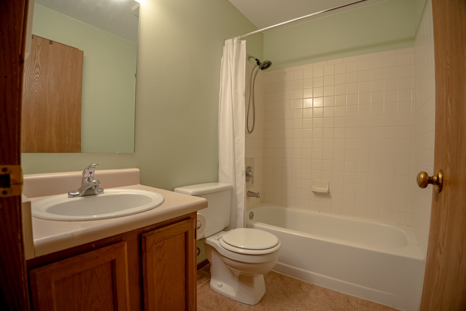 20 Gant Circle, Unit E Streamwood, IL 60107 - Photo 15 of 20 a bathroom with a sink a toilet and shower