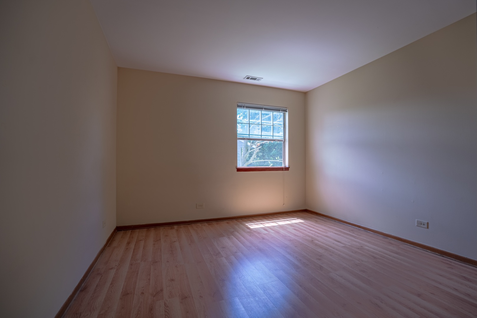20 Gant Circle, Unit E Streamwood, IL 60107 - Photo 17 of 20 an empty room with wooden floor and windows