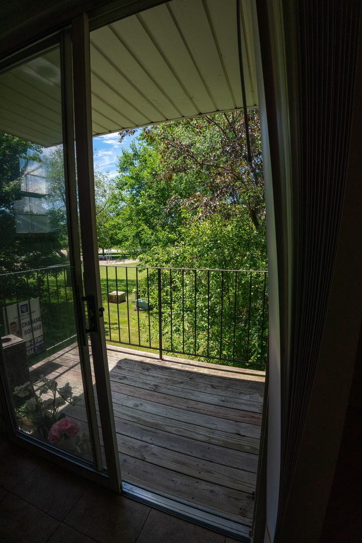 20 Gant Circle, Unit E Streamwood, IL 60107 - Photo 19 of 20 a view of a glass door with a yard