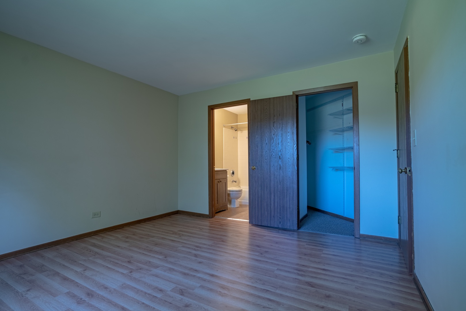 20 Gant Circle, Unit E Streamwood, IL 60107 - Photo 20 of 20 a view of an empty room with wooden floor and closet