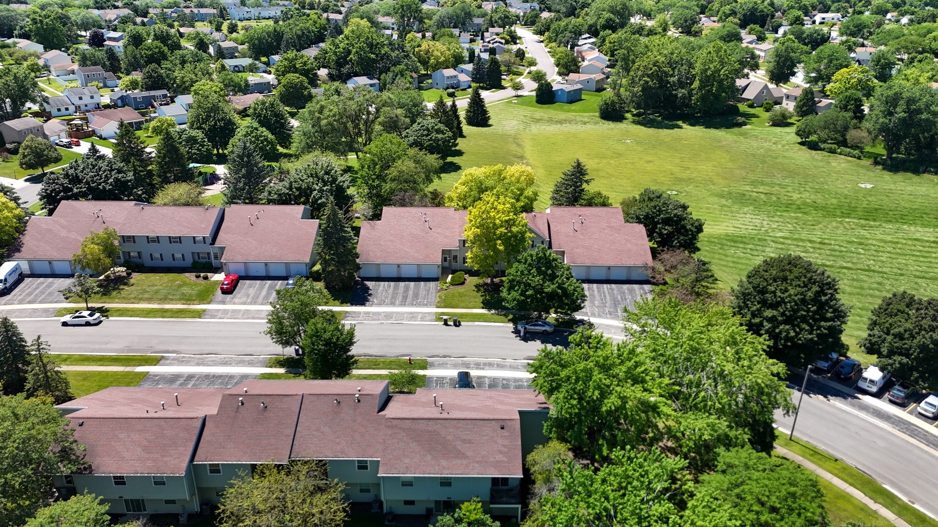 20 Gant Circle, Unit E Streamwood, IL 60107 - Photo 2 of 20 an aerial view of house with yard swimming pool and outdoor seating