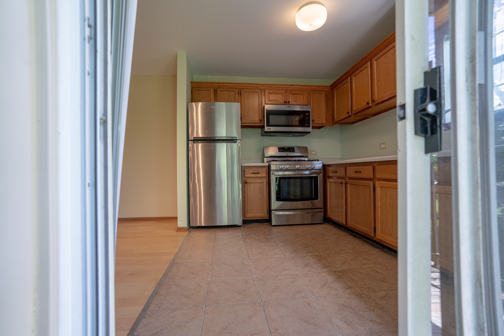 20 Gant Circle, Unit E Streamwood, IL 60107 - Photo 7 of 20 a view of a kitchen with stainless steel appliances granite countertop a refrigerator and a sink