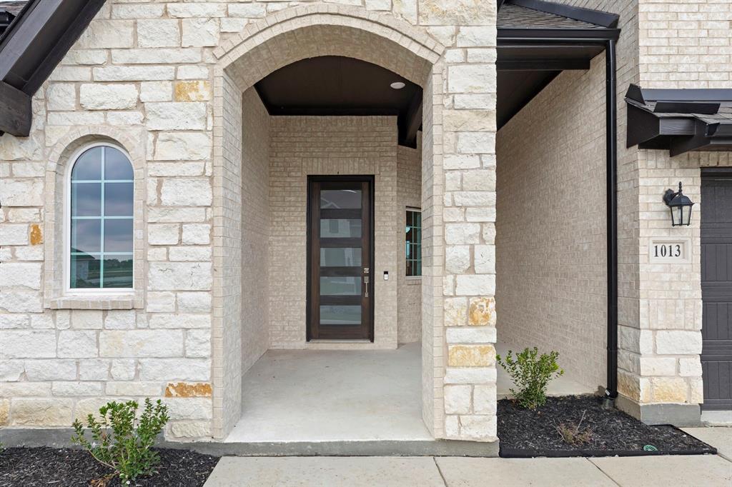 1013 Butterfly Lane Justin, TX 76247 - Photo 2 of 34 1013-butterfly-ln-justin-tx-entryway-front-door