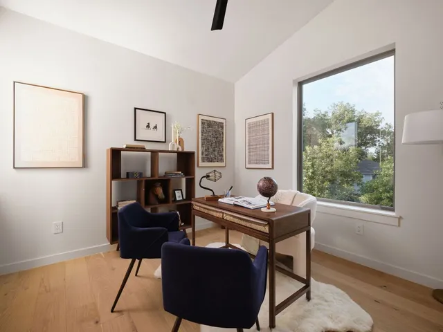 a work room with furniture and windows