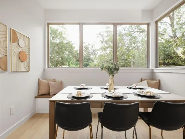 a view of a dining room with furniture window and outside view