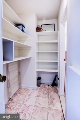 a living room with a table and chairs