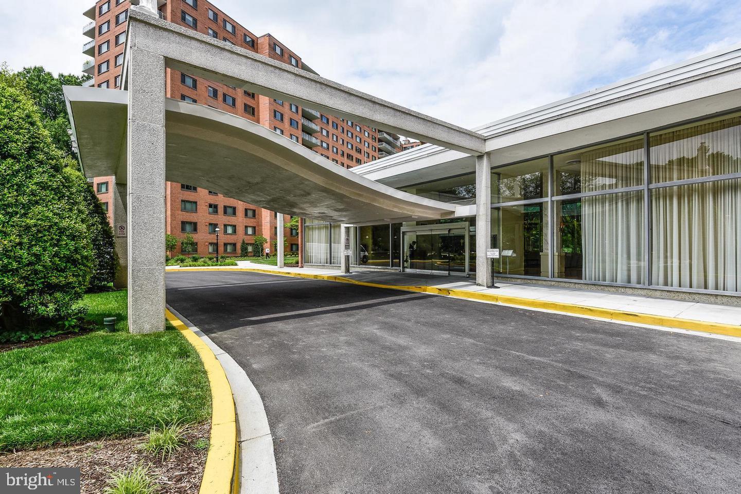 4201 Cathedral Avenue Northwest, Unit 1411E Washington, DC 20016 - Photo 4 of 66 a view of swimming pool with a patio and a yard