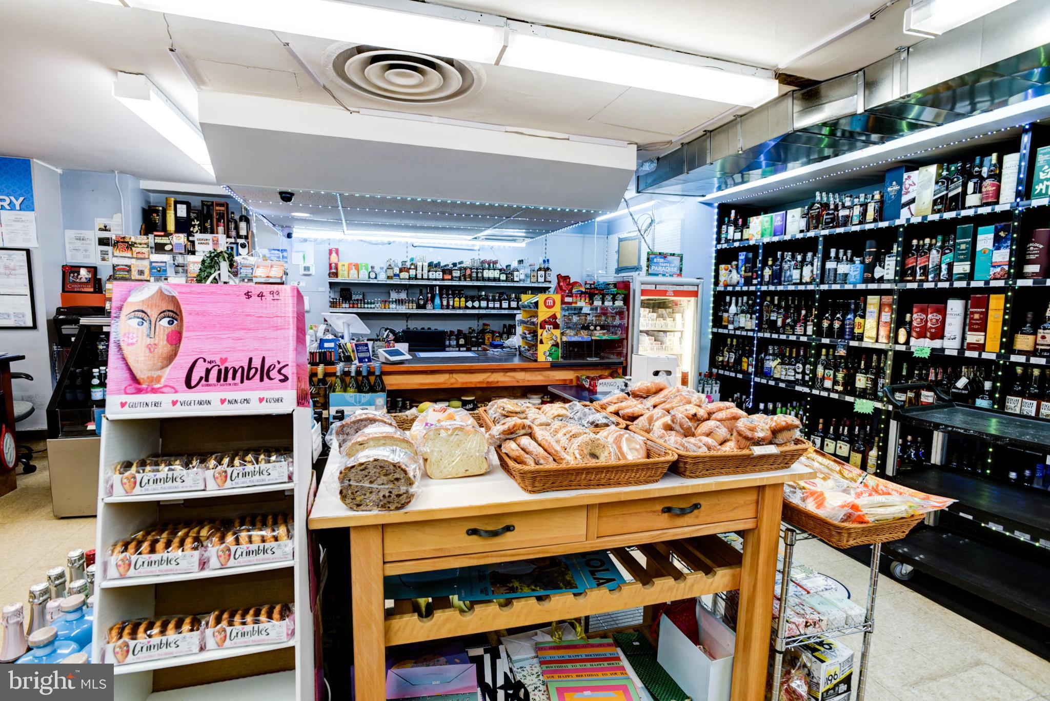 4201 Cathedral Avenue Northwest, Unit 1411E Washington, DC 20016 - Photo 60 of 66 a store area with lots of furniture and a book shelf