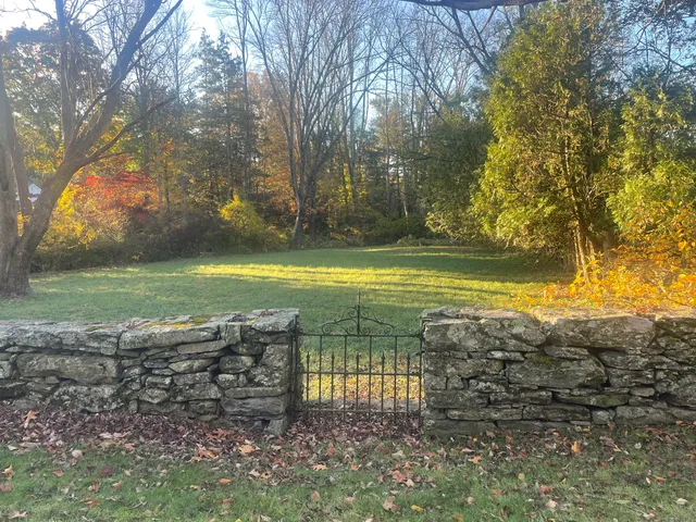 a view of a yard with an ocean view