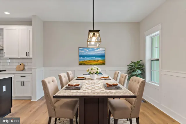 a view of staircase with white walls and railing