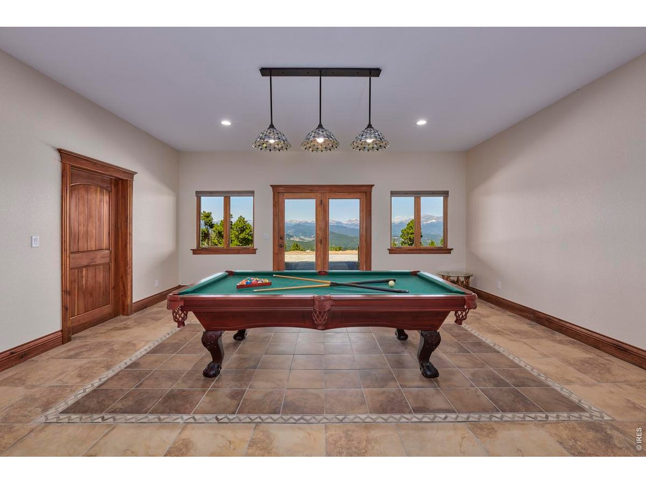 200 Kimwood Road Black Hawk, CO 80422 - Photo 21 of 44 Family room with direct access to the new stone patio for easy indoor-outdoor living