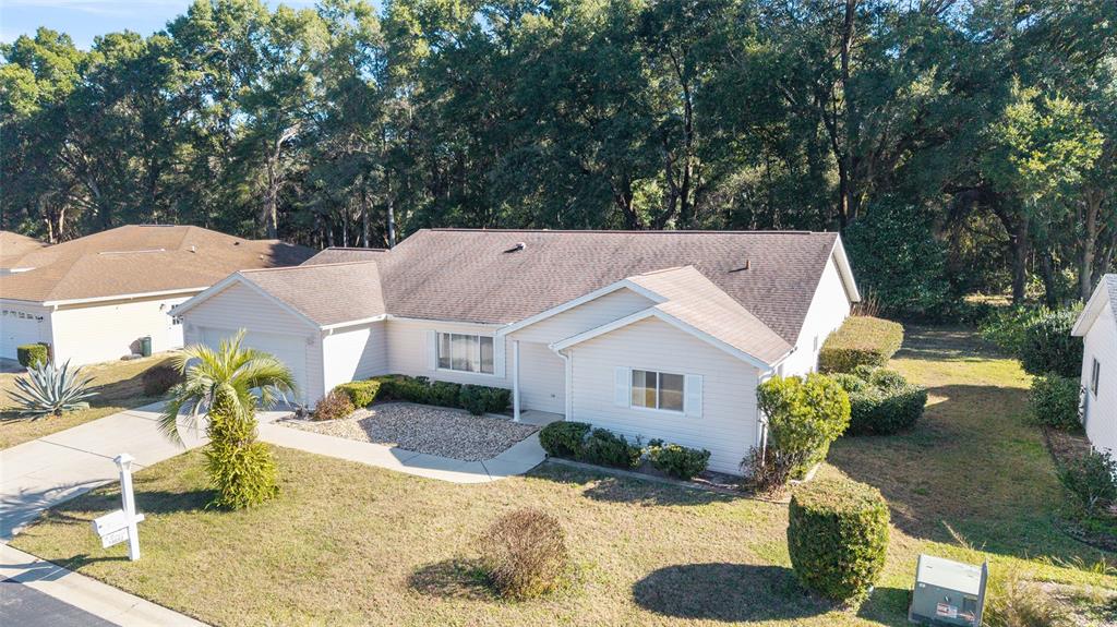 a aerial view of a house with a yard
