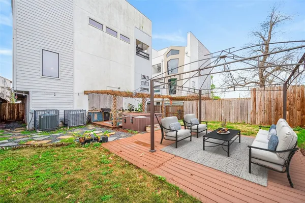 a view of a patio with couches chairs and a fire pit