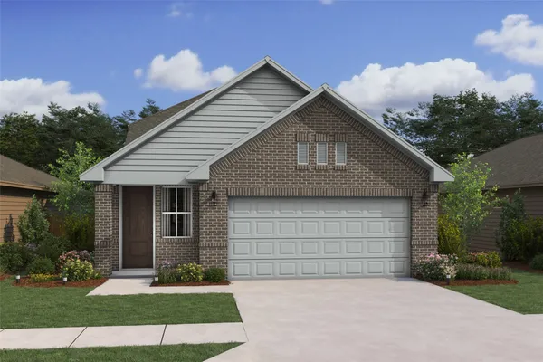 a front view of a house with a garden and garage