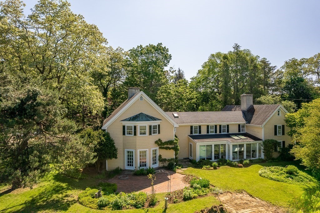 466 Bridge Street Hamilton, MA 01982 - Photo 1 of 40 a front view of a house with a yard