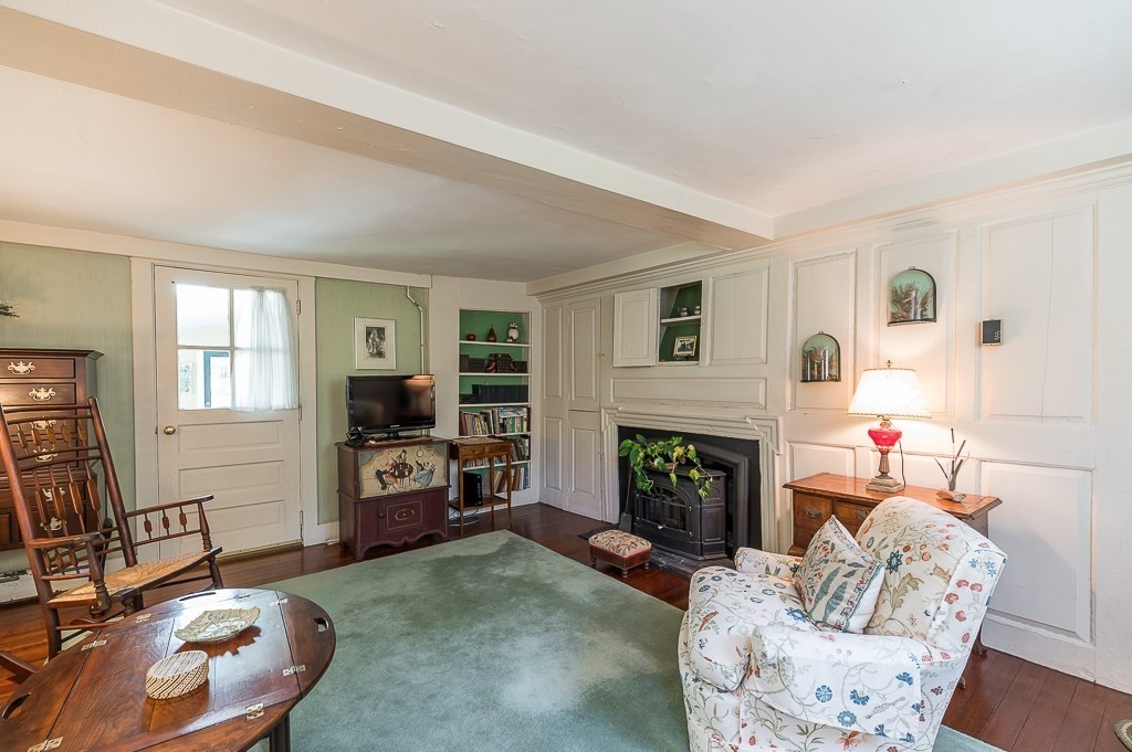 466 Bridge Street Hamilton, MA 01982 - Photo 16 of 40 a living room with furniture and a fireplace