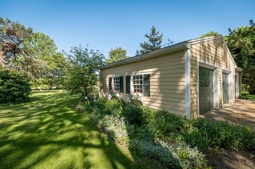 466 Bridge Street Hamilton, MA 01982 - Photo 25 of 40 a front view of house with yard and green space