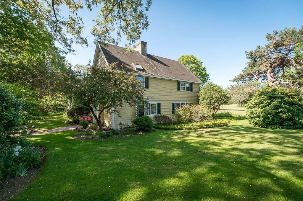 466 Bridge Street Hamilton, MA 01982 - Photo 26 of 40 a backyard of a house with plants and large tree
