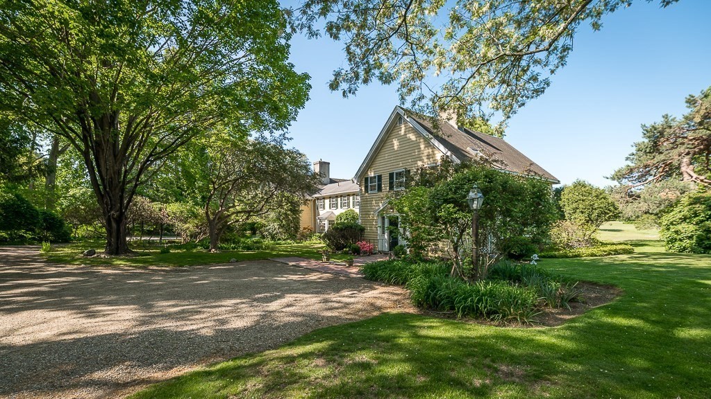 466 Bridge Street Hamilton, MA 01982 - Photo 27 of 40 a view of a house with a tree in a yard
