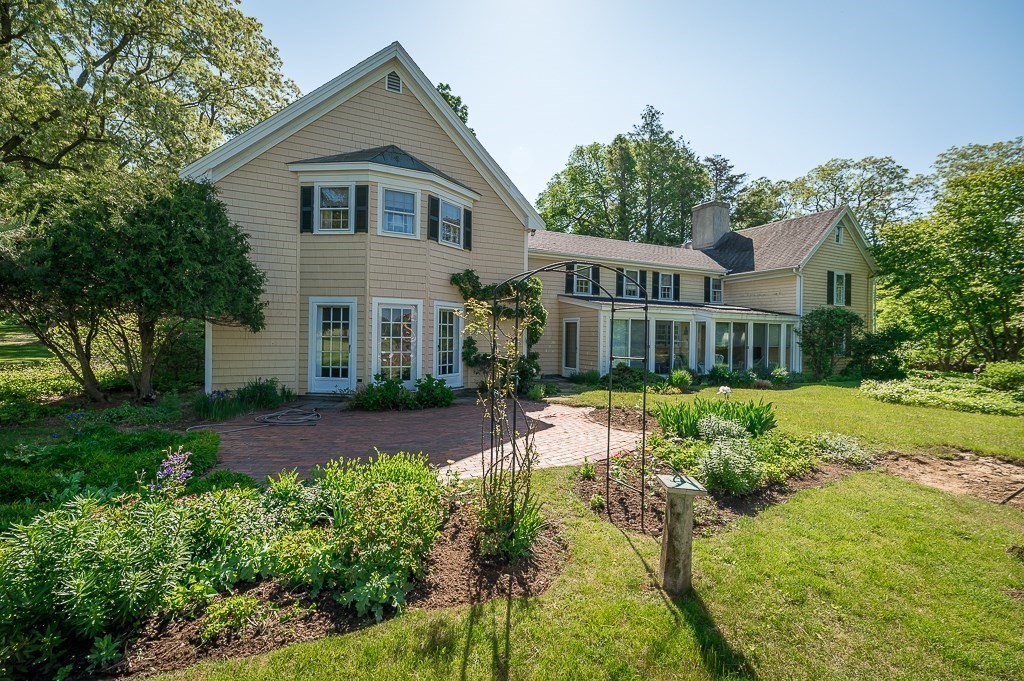 466 Bridge Street Hamilton, MA 01982 - Photo 29 of 40 a front view of a house with a yard and porch