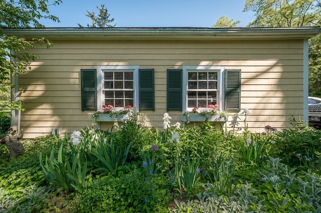 466 Bridge Street Hamilton, MA 01982 - Photo 30 of 40 a front view of a house with a yard