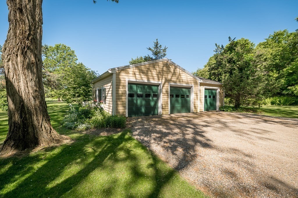 466 Bridge Street Hamilton, MA 01982 - Photo 32 of 40 a front view of a house with a garden
