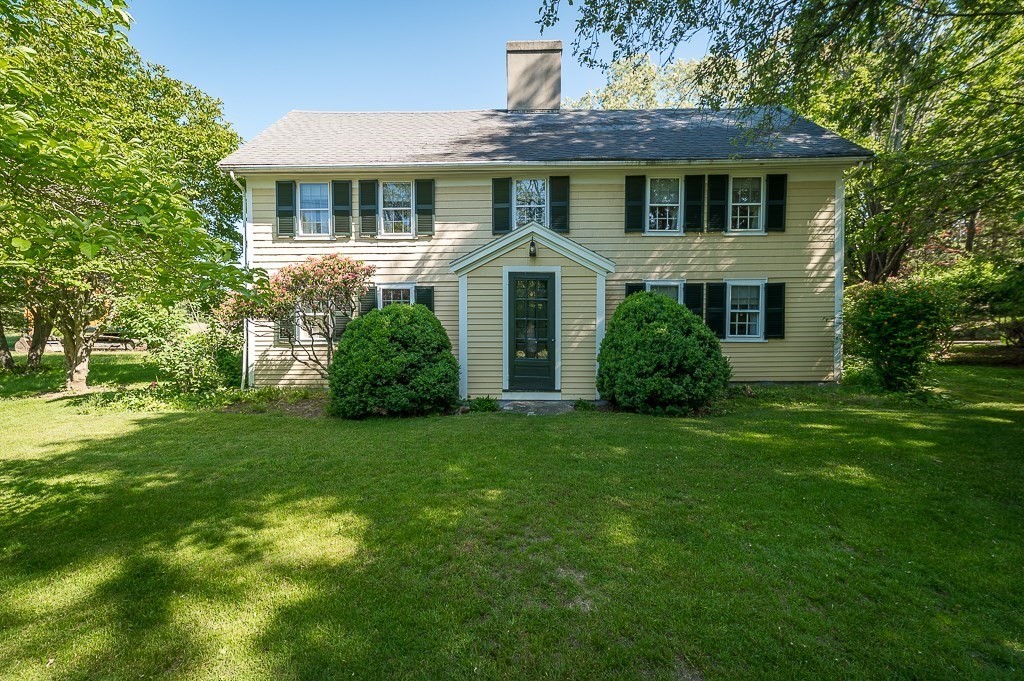 466 Bridge Street Hamilton, MA 01982 - Photo 4 of 40 a front view of a house with a garden