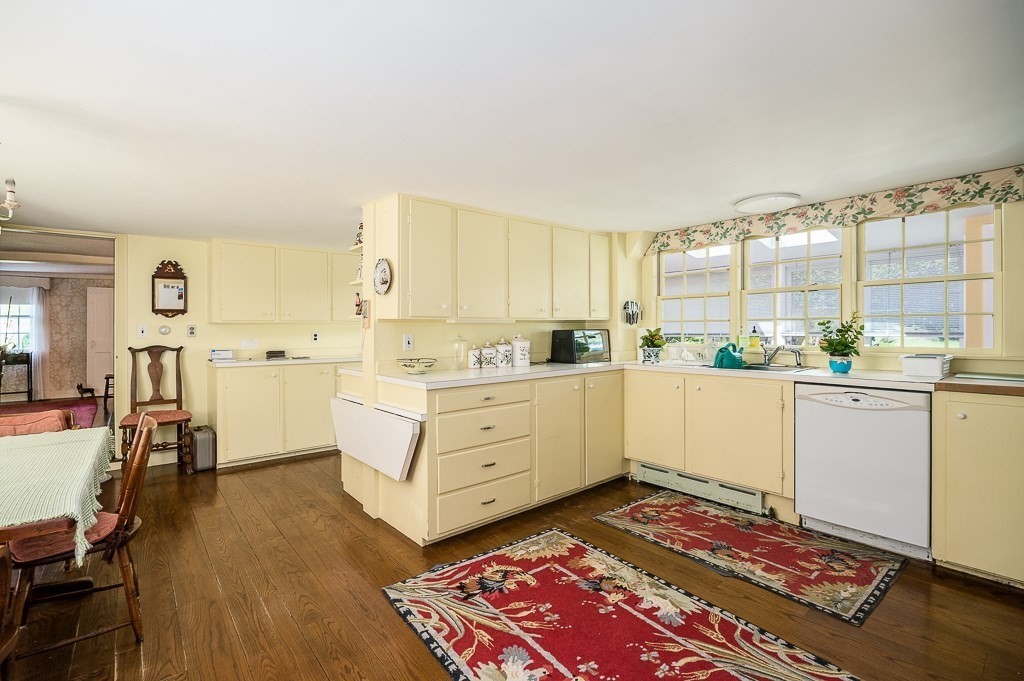 466 Bridge Street Hamilton, MA 01982 - Photo 10 of 40 a kitchen with white cabinets and counter space