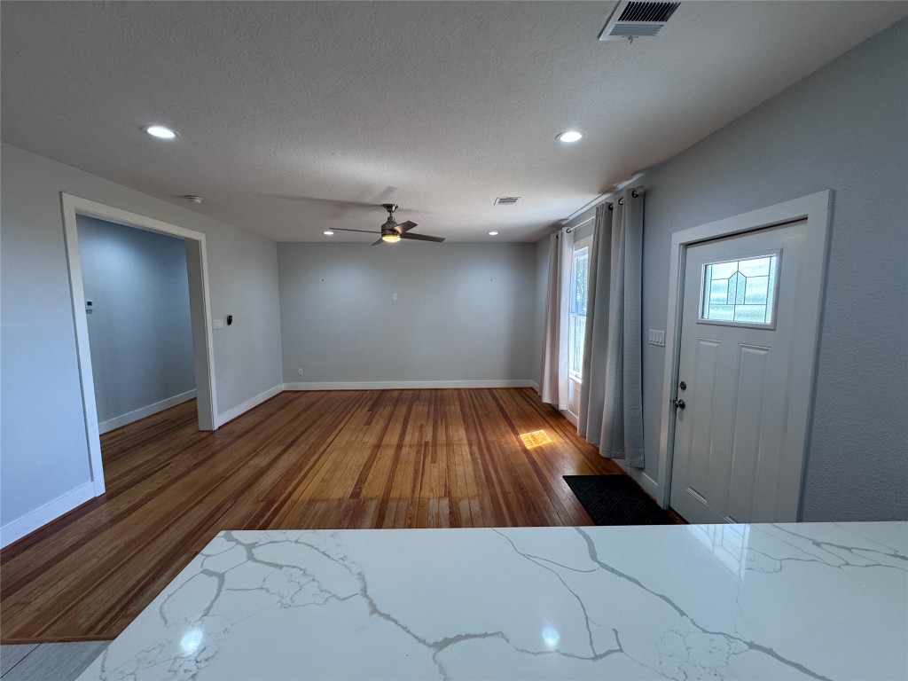 939 Knape Road La Grange, TX 78945 - Photo 17 of 37 Foyer with wood finished floors, ceiling fan, recessed lighting, and a textured ceiling