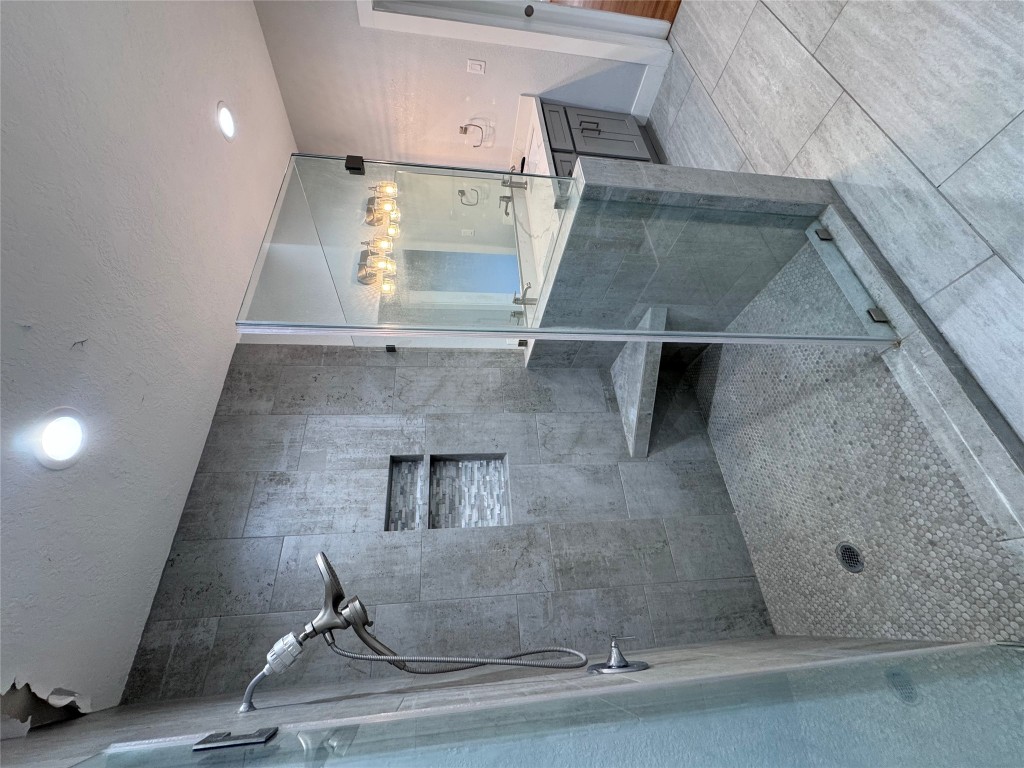 939 Knape Road La Grange, TX 78945 - Photo 23 of 37 Bathroom with vanity, a shower stall, light tile patterned floors, a textured ceiling, and recessed lighting