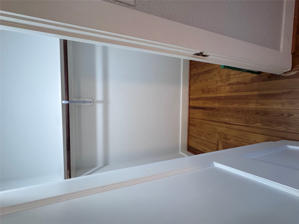 939 Knape Road La Grange, TX 78945 - Photo 25 of 37 Walk in closet featuring dark wood-type flooring