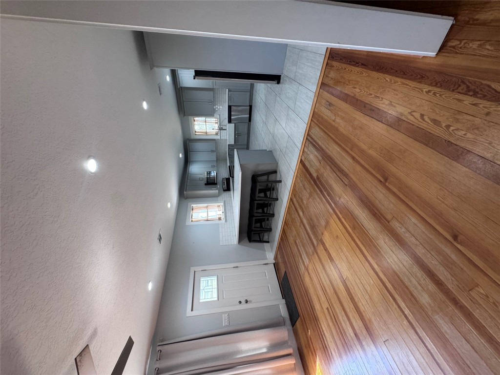 939 Knape Road La Grange, TX 78945 - Photo 30 of 37 Unfurnished living room with light wood-type flooring, a textured ceiling, and recessed lighting