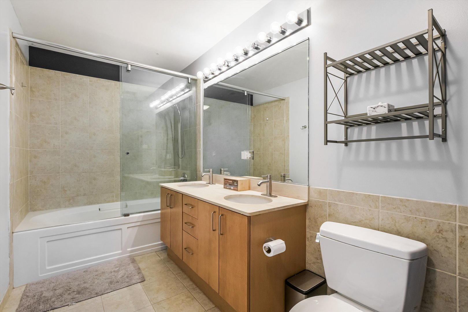 1720 South Michigan Avenue, Unit 308 Chicago, IL 60616 - Photo 12 of 23 a bathroom with a sink a toilet and shower