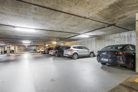 a view of parking space with parked cars