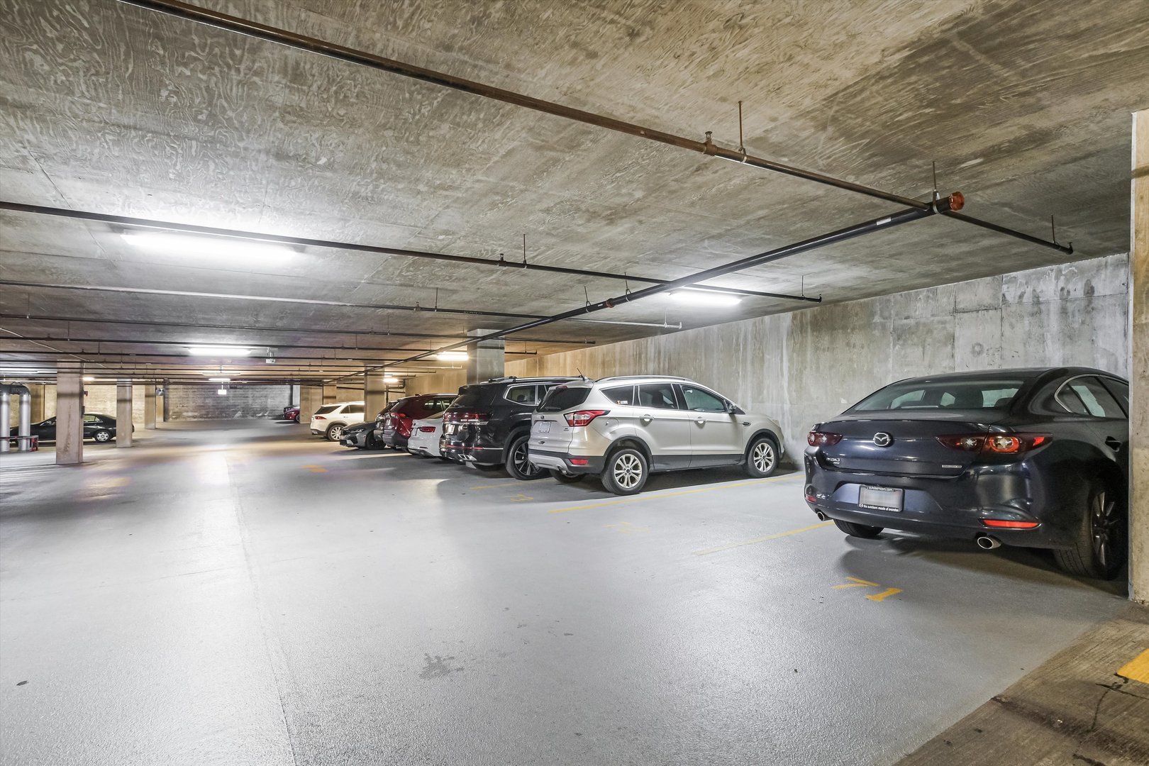 1720 South Michigan Avenue, Unit 308 Chicago, IL 60616 - Photo 21 of 23 a view of parking space with parked cars
