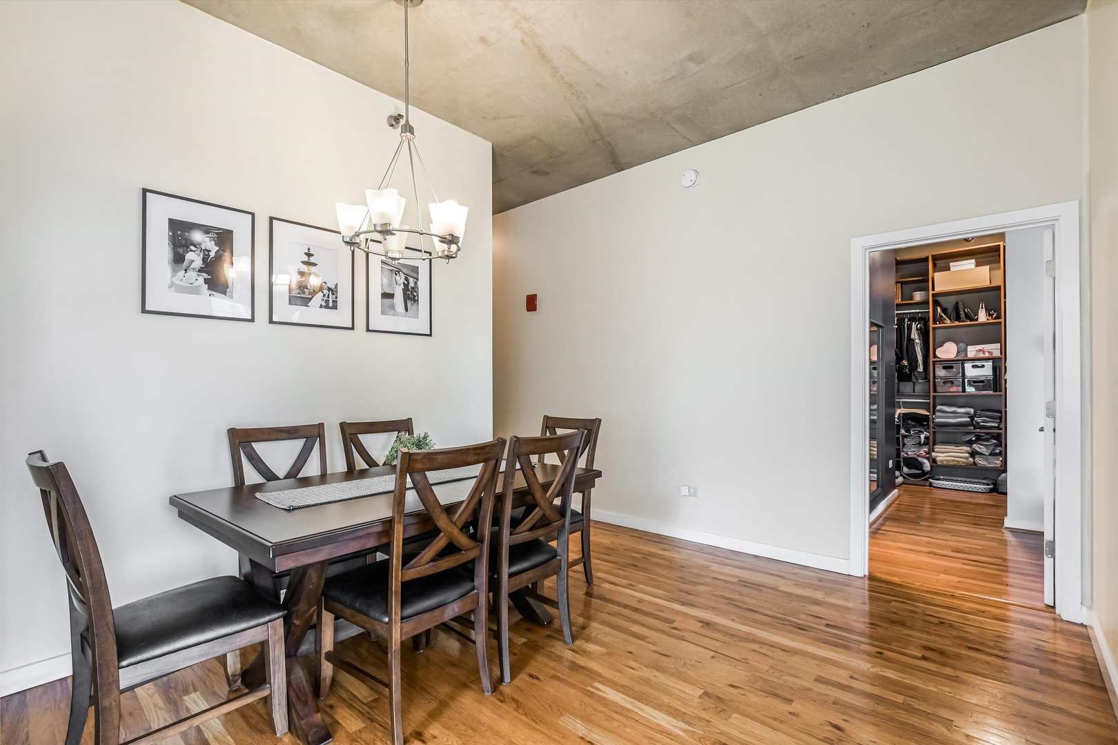 1720 South Michigan Avenue, Unit 308 Chicago, IL 60616 - Photo 8 of 23 a view of a dining room with furniture and wooden floor