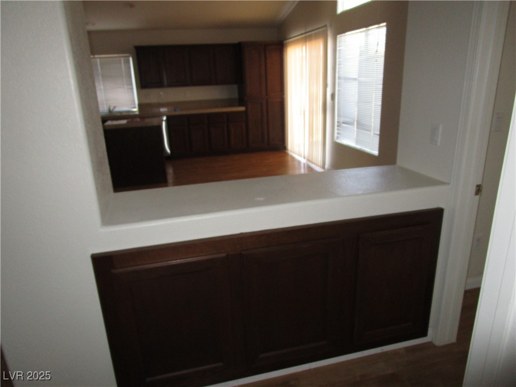 1966 Windfall Avenue Henderson, NV 89012 - Photo 12 of 13 Kitchen with wood finished floors, light countertops, and lofted ceiling