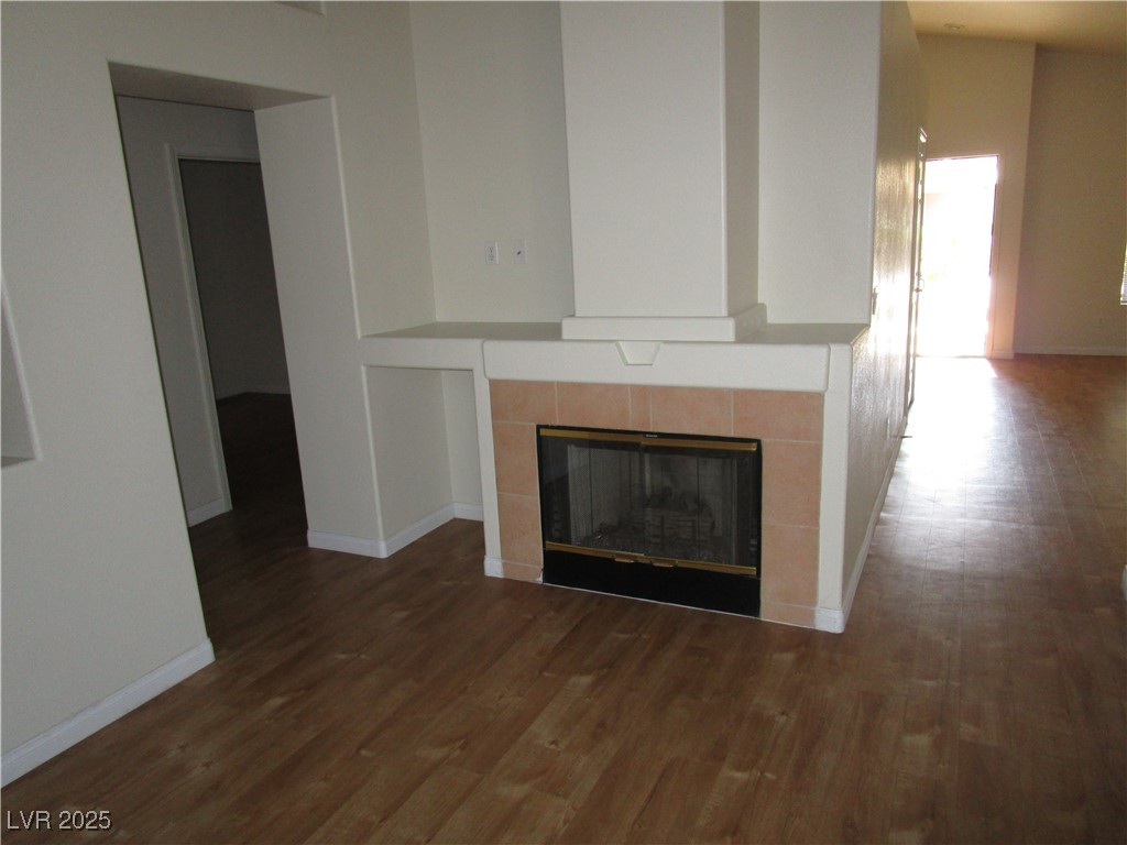 1966 Windfall Avenue Henderson, NV 89012 - Photo 7 of 13 Detailed view of a tiled fireplace and wood finished floors