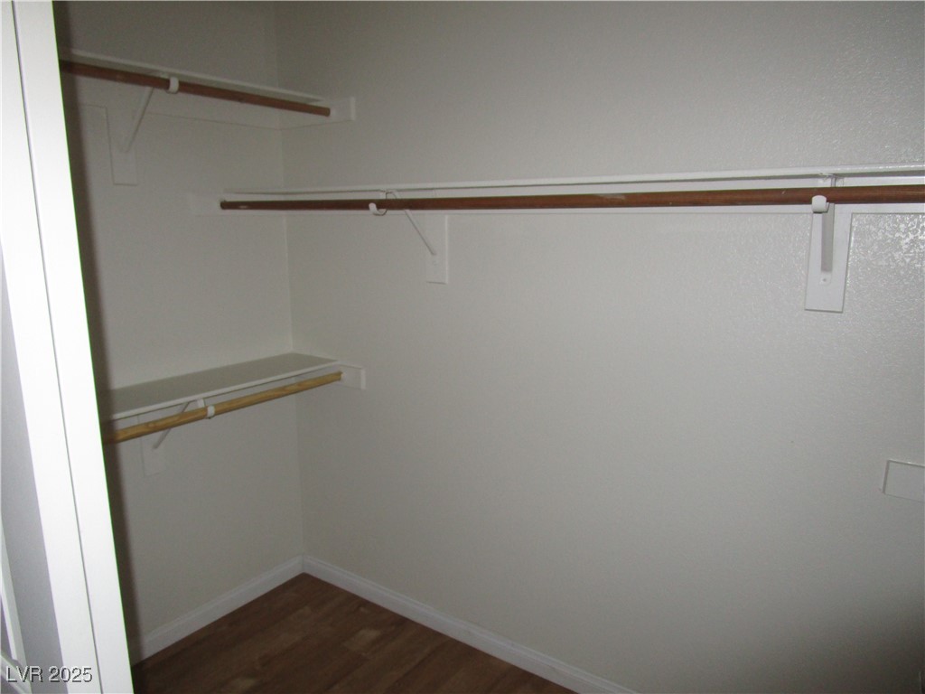 1966 Windfall Avenue Henderson, NV 89012 - Photo 9 of 13 Spacious closet featuring dark wood-style flooring