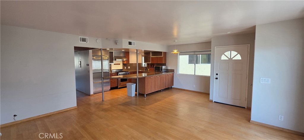 a view of a kitchen and a sink cabinet cabinet and a living room