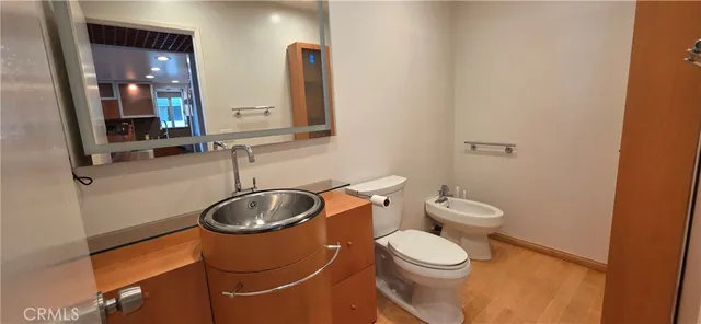 a bathroom with a toilet and sink