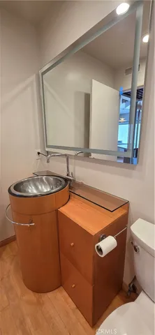 a room with a sink and a mirror