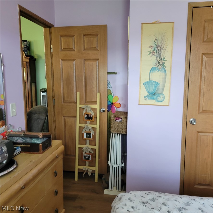 9531 McCormick Road Southwest Newcomerstown, OH 43832 - Photo 22 of 44 Bedroom featuring dark hardwood / wood-style floors