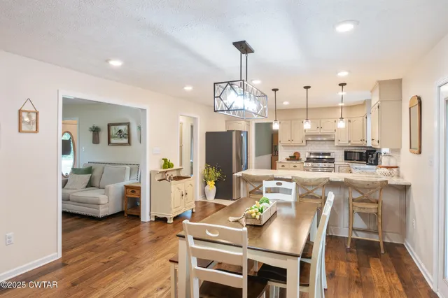 a bathroom with a sink and a potted plant