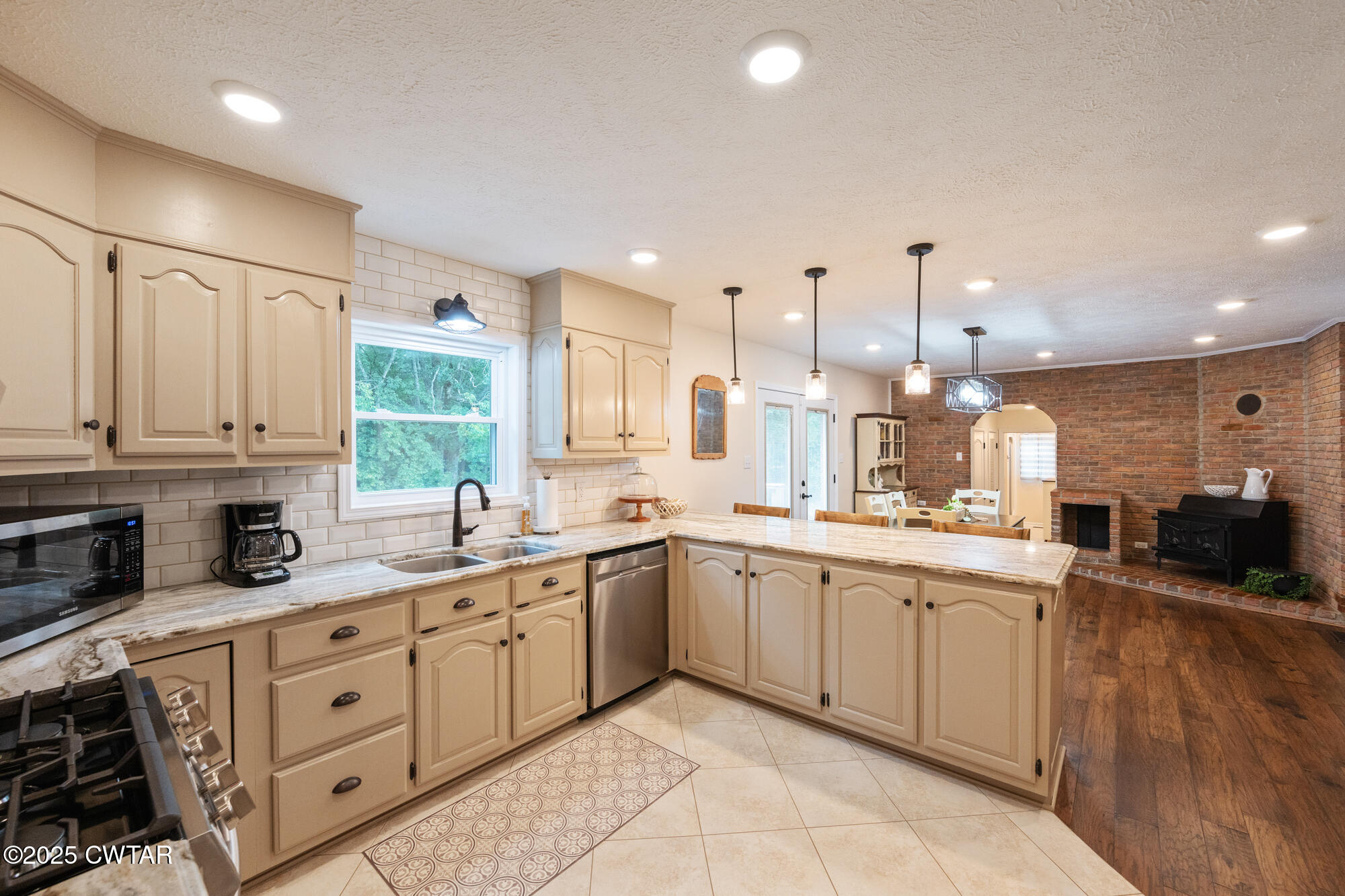 105 Center Hill-Wright Road Reagan, TN 38368 - Photo 18 of 42 a large kitchen with stainless steel appliances lots of counter space sink and cabinets